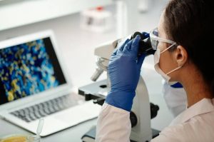 “Laboratory specialist examining samples; the high sensitivity and accuracy of RealCycler kits ensure reliable results.”